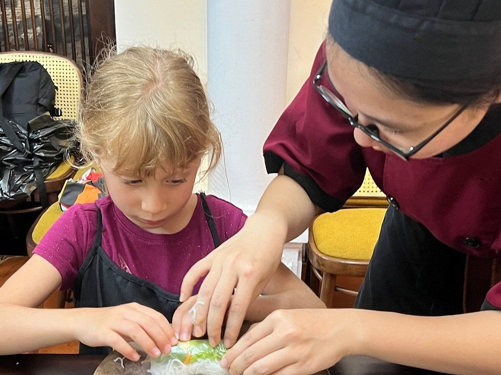 Relaxed Vietnamese Cooking Class with Market Tour and Homemade Wine Tasting
