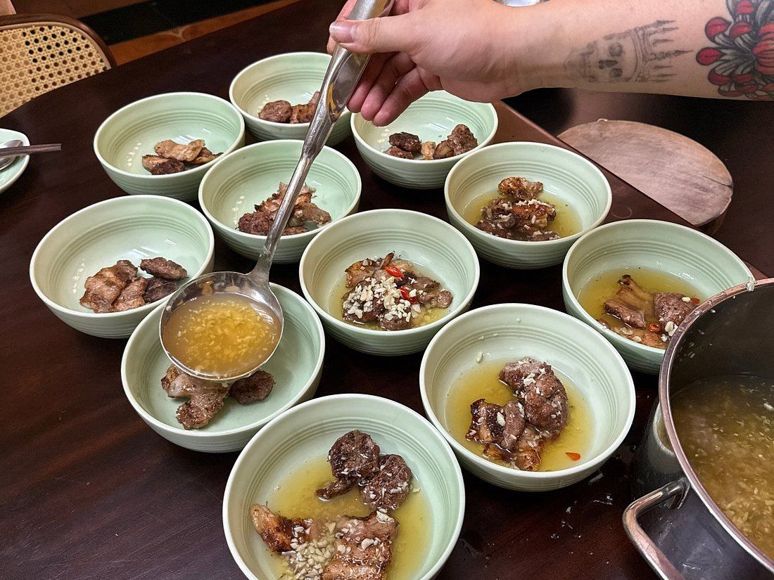 Relaxed Vietnamese Cooking Class with Market Tour and Homemade Wine Tasting